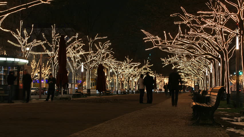 Peoples on boulevard with Christmas tree lights 