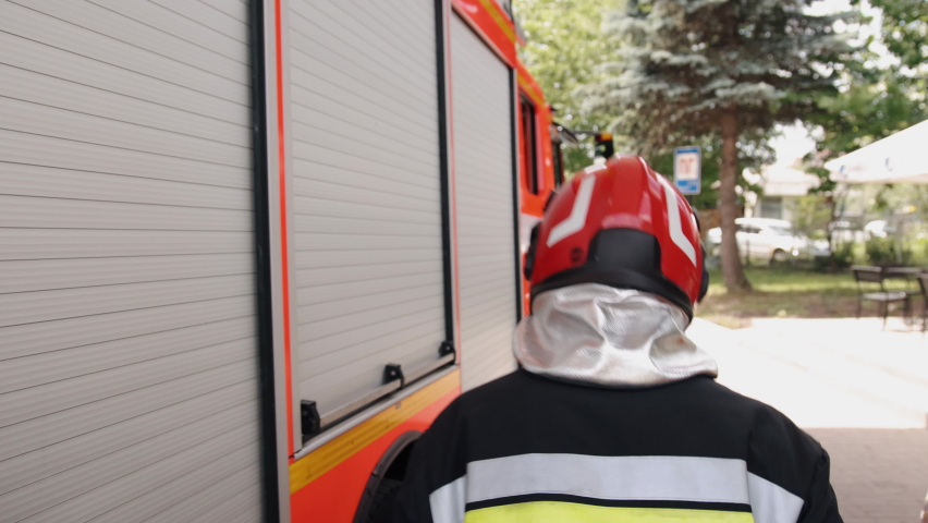 Brave firefighter in protective gear is equipped with all the necessary equipment to deal with fire, suppression of fires, and assistance to mine victims. Royalty-Free Stock Footage #1092088973