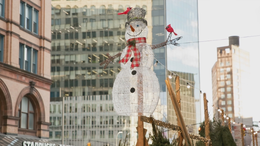 NYC, USA - DEC 25, 2018: Christmas snowman ornaments on Astor Place and Cooper Square, Manhattan New York City.