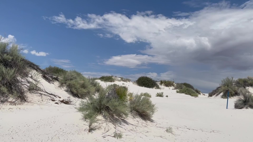 Beautiful gypsum dune vista at the White Sands National Park set against dramatic sky during the monsoon season, Southern New Mexico