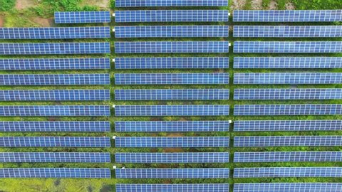 Top view of a solar power station, Renewable green energy, Alternative energy sources. Clean energy industry in Samut Songkhram, Thailand. drone footage. 4k
