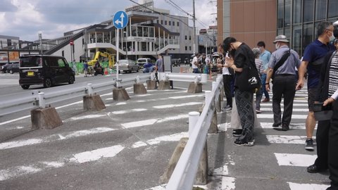 Nara, Japan - July 9 2022: Shinzo Abe Assassinated in front of Train Station During Speech, Japanese People Pray for his Memory 
