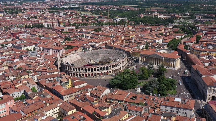 Circular flight over Piazza Brà In the city of Verona. Top view of the central historical part of the city of Verona, Italy. Aerial view of the Arena di Verona in Italy. Royalty-Free Stock Footage #1092095397