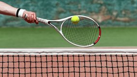 Super slow motion of tennis player hitting the ball. Close-up of forehand hit. Filmed on high speed cinema camera, 1000fps. - Powered by Shutterstock - Get 15% off with code: PIKWIZARD15