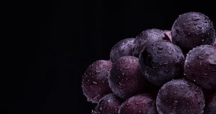 Videotaping large grapes on a rotating table.
Black background.
A variety called 