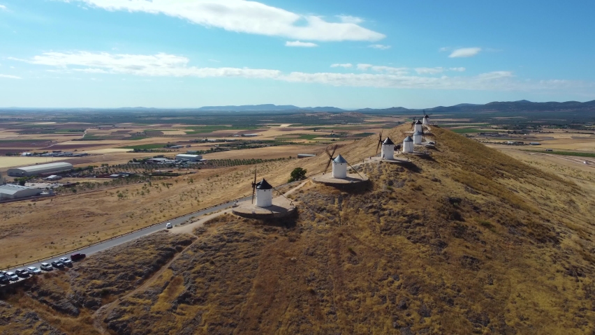 Windmill of Consuegra in a cinematic perspective from drone. Famouse location known as  the land of Don Quixote.  Situated in Toledo province. Drone forward
