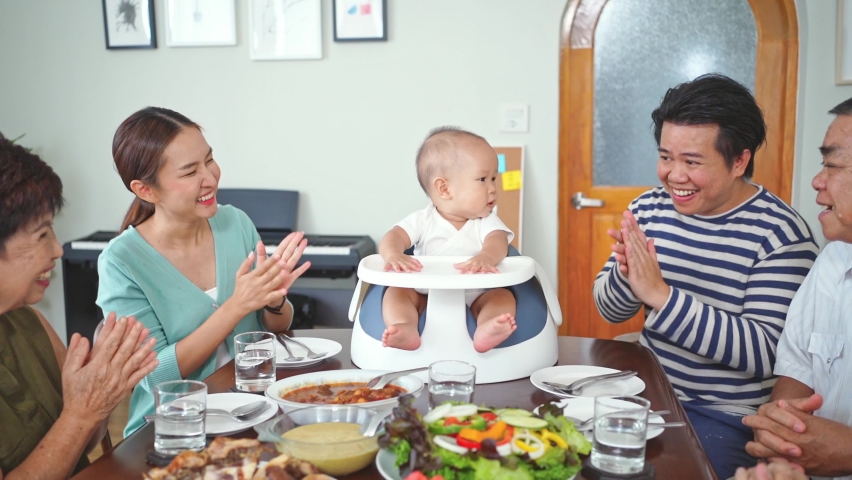 Happy asian family enjoy having lunch, dinner together at home Royalty-Free Stock Footage #1092107791
