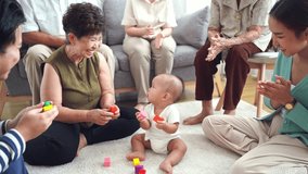 Asian big family enjoy playing with new member baby at home - Powered by Shutterstock - Get 15% off with code: PIKWIZARD15