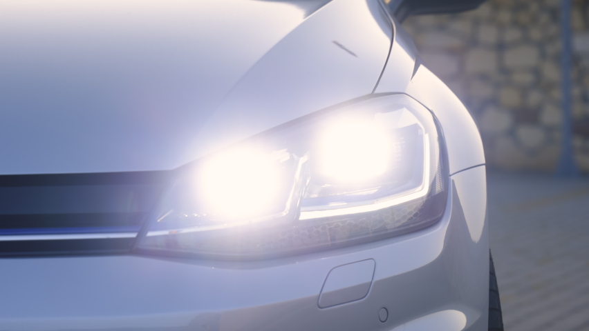 Car Front Full Led Light. Modern car headlamp flashing light with blinking on continuously indicator. Switched on led lights of luxury car. Car Blinker Light. Royalty-Free Stock Footage #1092109393