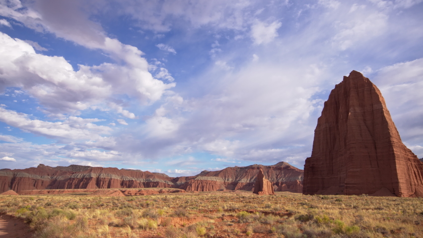 Temple of the Sun and the Moon in Capitol Reef National Park Utah as clouds move through the sky.