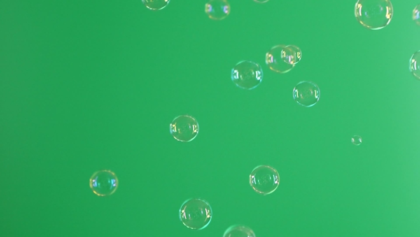 Slow motion of soap air bubbles texture on chroma key green screen background Royalty-Free Stock Footage #1092122437