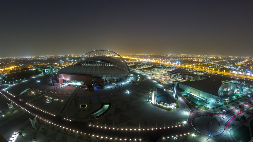 Aerial view of Aspire Zone from top night to day timelapse in Doha. Traffic on the road. Foggy weather Royalty-Free Stock Footage #1092130979