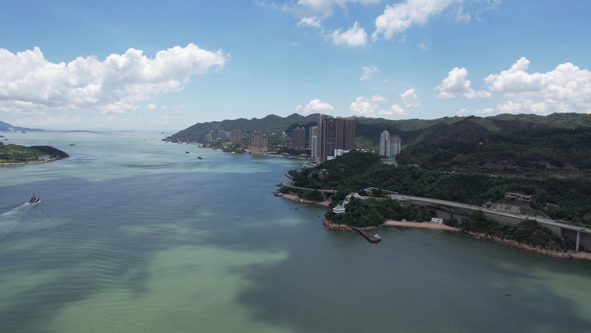 City Skyview in Hong Kong 4K Aerial drone shot Highway Flyover Traffic on Ma Wan Lantau Island Tsing Yi in Ting Kau Bridge and Tsing Ma Bridge, It has two decks and carries both road and rail Royalty-Free Stock Footage #1092132087