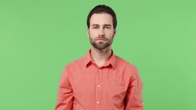 Smiling cheerful happy young brunet bearded man 20s years old wears pink shirt showing okay ok zero fingers gesture isolated plain green background studio portrait. People emotions lifestyle concept