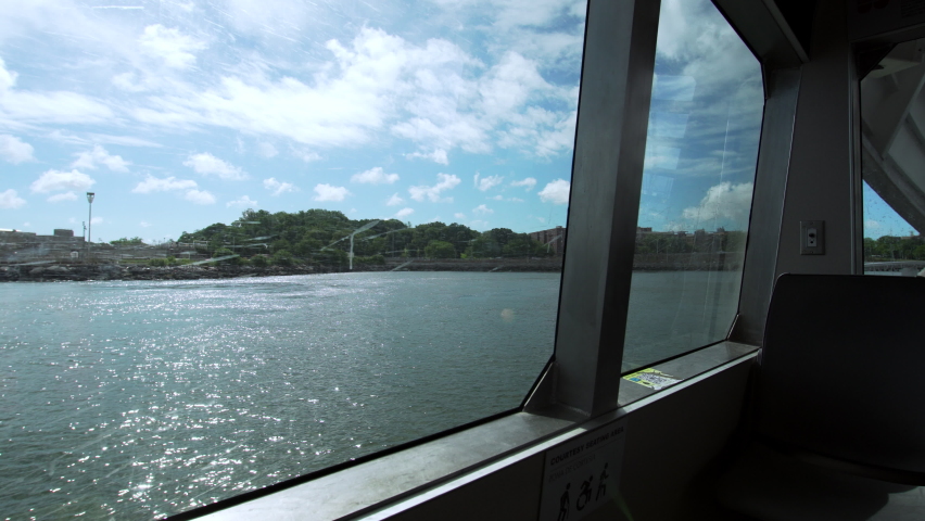 View from the fery window. Sailing near Bay Ridge, a neighborhood in the southwest corner of the New York City borough of Brooklyn. Nice summer day. USA