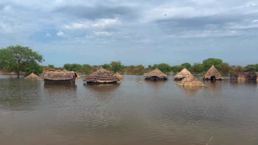 flooded rural village houses dipped in water disaster situation south Sudan Bentiu  Royalty-Free Stock Footage #1092150647
