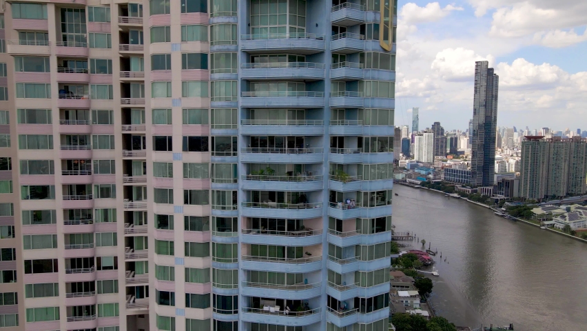 Bangkok skyscrapers Cityscape by Chao Phraya River, Aerial sideways shot, Thailand