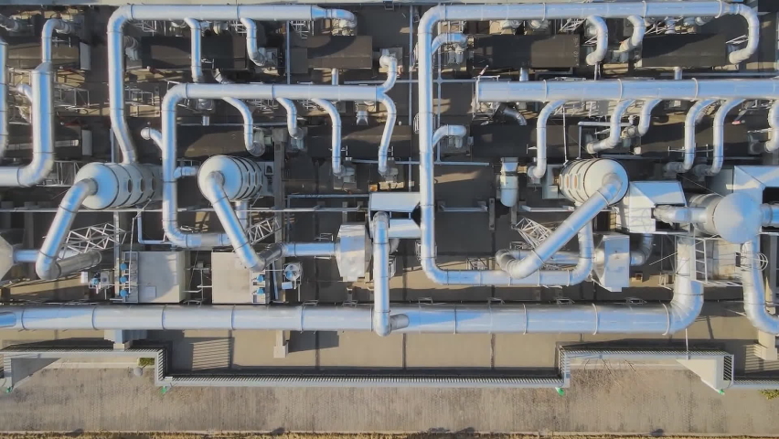 Aerial view of the pipelines of a chemical plant, the production of ammonia fertilizers. Royalty-Free Stock Footage #1092156651
