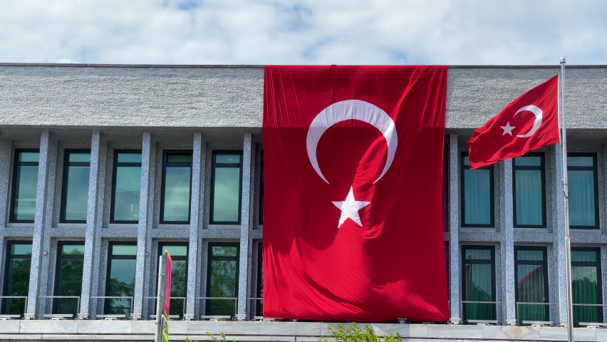 One Big One little Turkish flag waving side by side above the building wonderful panoramic view 4K video footage buying now.  Royalty-Free Stock Footage #1092161545