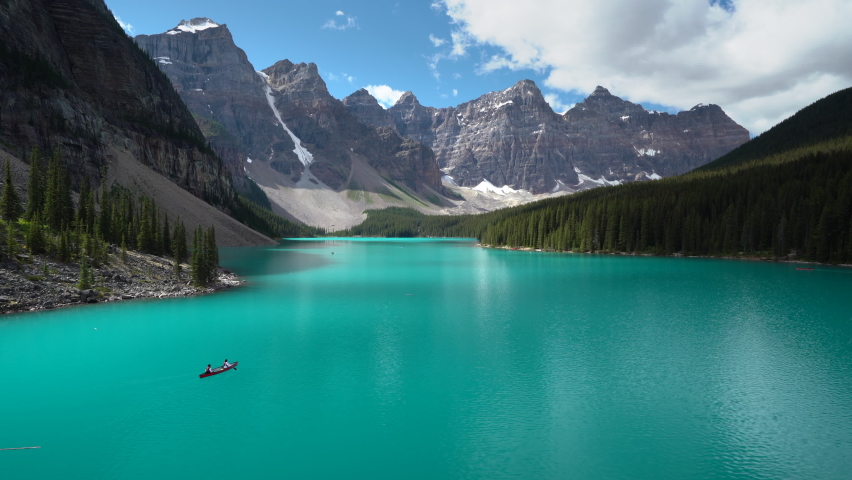 Tourists canoeing on Moraine Lake during summer in Banff National Park, Alberta, Canada. Royalty-Free Stock Footage #1092165921