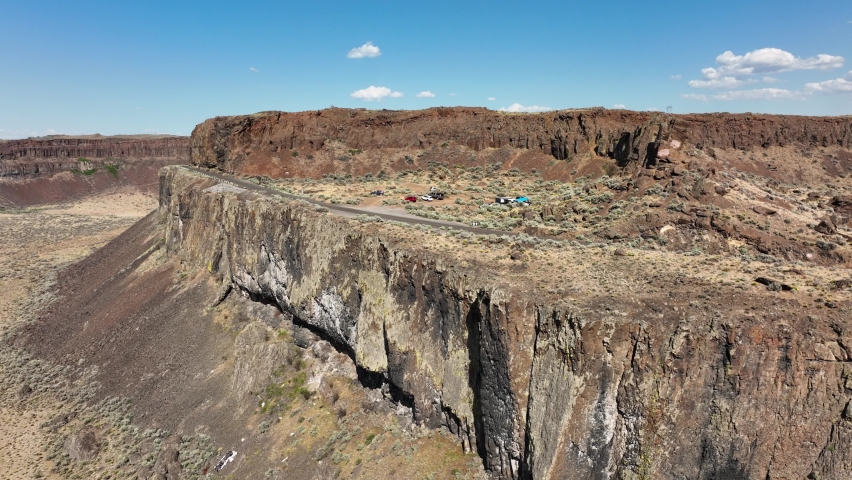 Orbiting aerial of cliffs in the Washington desert region.