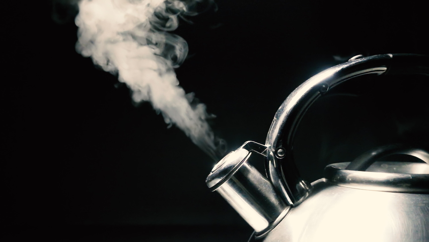 Boiling steel silver kettle with a whistle with steam close-up on a black background. 4k raw slow motion video with speed ramp effect. Filmed on high speed cinema camera. | Shutterstock HD Video #1092200275