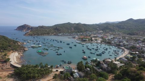 AERIAL VIEW OF THE VINH HY BAY, NINH THUAN, VIETNAM. . BEAUTIFUL SEA WAVES. PINK SAND AND AMAZING SEA. SUMMER SUNSET SEASCAPE. TOP VIEW OF THE FANTASTIC NATURAL. 4K
