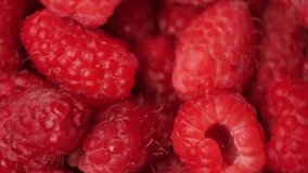 Macro video of spinning raspberries, top view