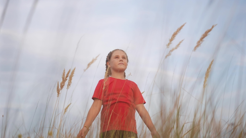 kid pray. pulls hands against a sky. child girl concept faith religion and happy family. kid girl pray hands to the side against sky jew kid praying to lifestyle god. worship and gratitude religion Royalty-Free Stock Footage #1092213827
