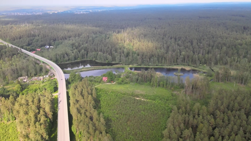View from the drone on Lake Komosa on a sunny day among the forests of Podlasie.