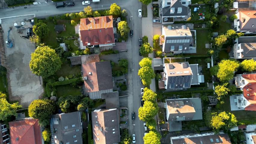 Birdseye aerial view suburban munich. drone flying top down over middle class family houses with small garden in europe. Edge of city residential area popular for young families. Royalty-Free Stock Footage #1092231413