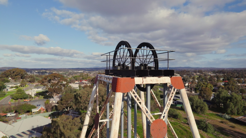 Close-up circling drone shot of Victoria Hill Mining Reserve poppet head in Bendigo
