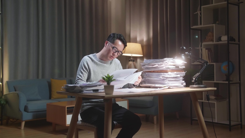 Asian Man Throwing Paper And Having Headache While Working Hard With Documents At Home
 | Shutterstock HD Video #1092234367