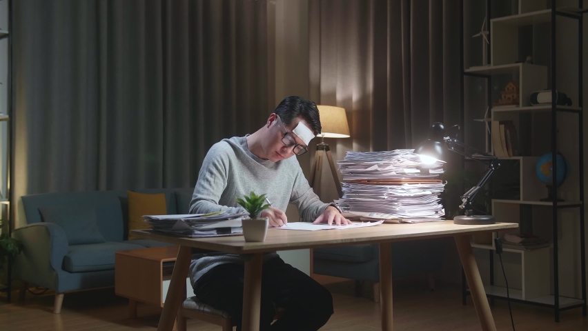 Sick Asian Man Tried While Working Hard With Documents At The Home
 | Shutterstock HD Video #1092234369