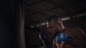 MMA training. Set of rapid clips with man fighter working out in the dark authentic gym. Fast paced edit of the boxer training in gym