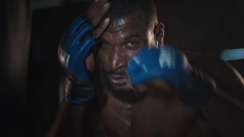 MMA training. Set of rapid clips with man fighter working out in the dark authentic gym. Fast paced edit of the boxer training in gym | Shutterstock HD Video #1092242695
