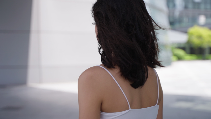 Charming young asian woman turn back looking at camera smile say I love you beautiful girlfriend