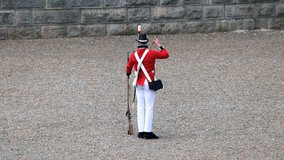 Members of a historical re-enactment group dressed like the 78th Highland Regiment British troops from 1869 at Citadel Hill,  Canada Day Celebrations. Halifax, Nova Scotia, Canada  - Powered by Shutterstock - Get 15% off with code: PIKWIZARD15