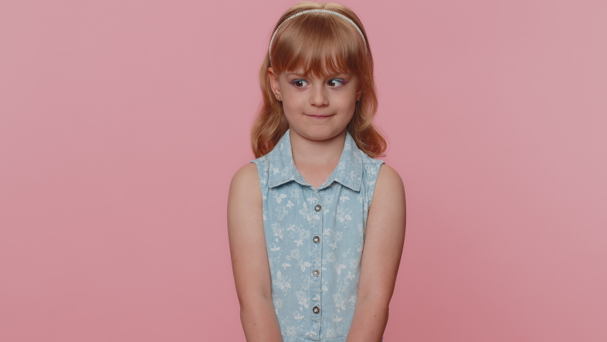 Portrait of cheerful caucasian child girl 3-4 years old showing tongue ...