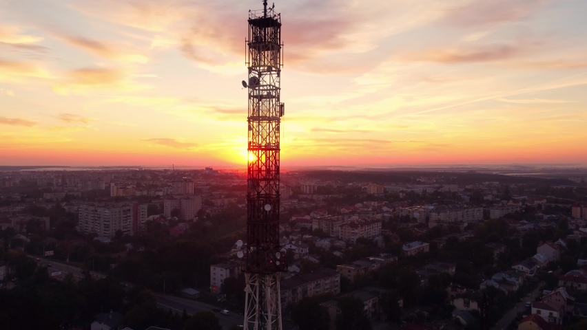 Television or radio telephone tower in a cityscape at sunset. Technology from a bird's eye view. Transmitter 5g. The concept of modern communications. Aerial video. Lviv, Ukraine. | Shutterstock HD Video #1092253809