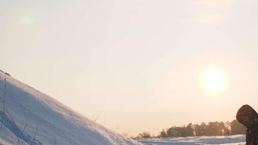 climbers go climbing the mountain forward. teamwork. travelers winter with backpacks sunset. climbing group people rise up. lifestyle love mountains adventure. active woman man teamwork give hand. sun