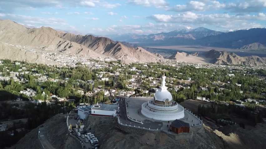 Aerial view Shanti Stupa buddhist white domed stupa overlooks the city of Leh, The stupa is one of the ancient and oldest stupas located in Leh city, Ladakh, Jammu Kashmir, India. Royalty-Free Stock Footage #1092259431