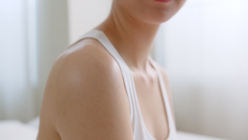 Young asian woman applying body lotion and skincare cream, beauty skin concept