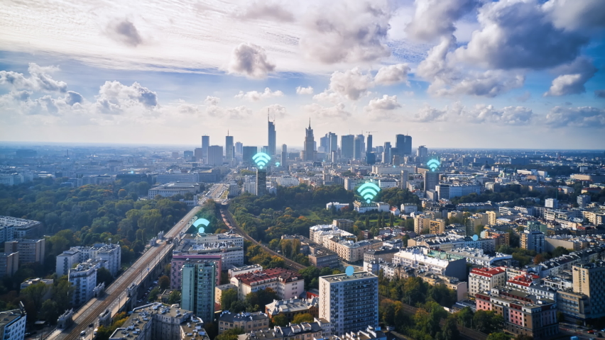 Forwards fly above city. Hyper lapse shot on urban borough and downtown skyscrapers in distance. Wifi symbols representing communication access points on buildings. Warsaw, Poland Royalty-Free Stock Footage #1092260933