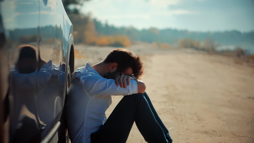 Sad Disappointed Man Sitting On Broken Car. Sad Exhausted Businessman. Confused Annoyed Tired Stressful Situation. Disappointed Problems Man On Car. Overworked Stressed Businessman Fired From Work | Shutterstock HD Video #1092262363