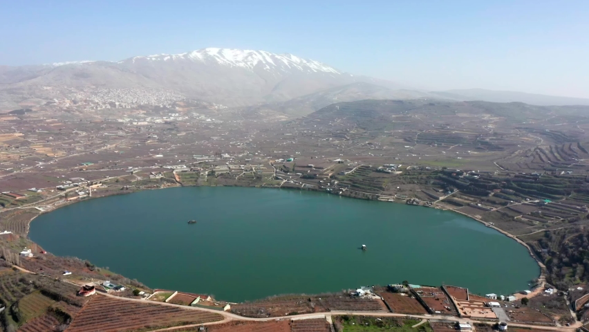 Ram Lake and snowy mount Hermon in Northern Israel, Drone footage.