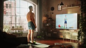 Home Training: Handsome Muscular Black Man Using Kettlebell, Exercising with Trainer via TV Online Video App. Strong Mixed Race Sportsman Using Workout Service Fitness Streaming App for Virtual Gym.