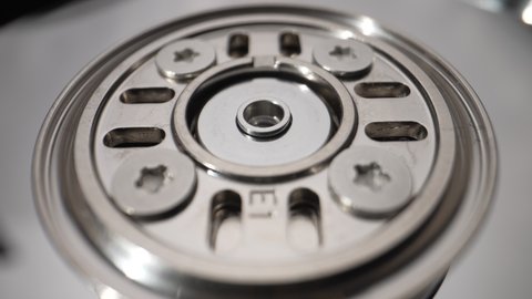 Rotating disks of a disassembled hard drive Close-up Slow motion