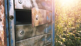Old rusty abandoned mailbox among thickets outdoor in the Chernobyl exclusion zone - Powered by Shutterstock - Get 15% off with code: PIKWIZARD15