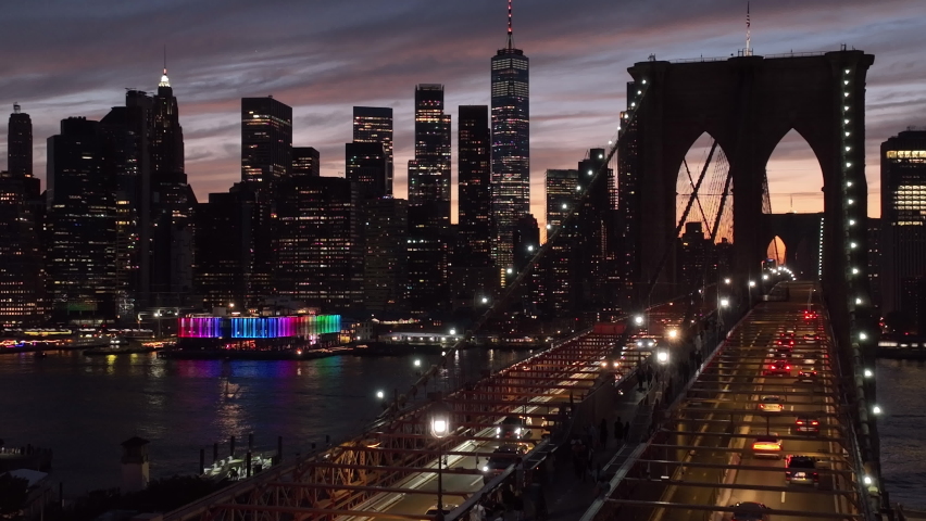flying right and backward view of Brooklyn Bridge and downtown NYC sunset Royalty-Free Stock Footage #1092290461